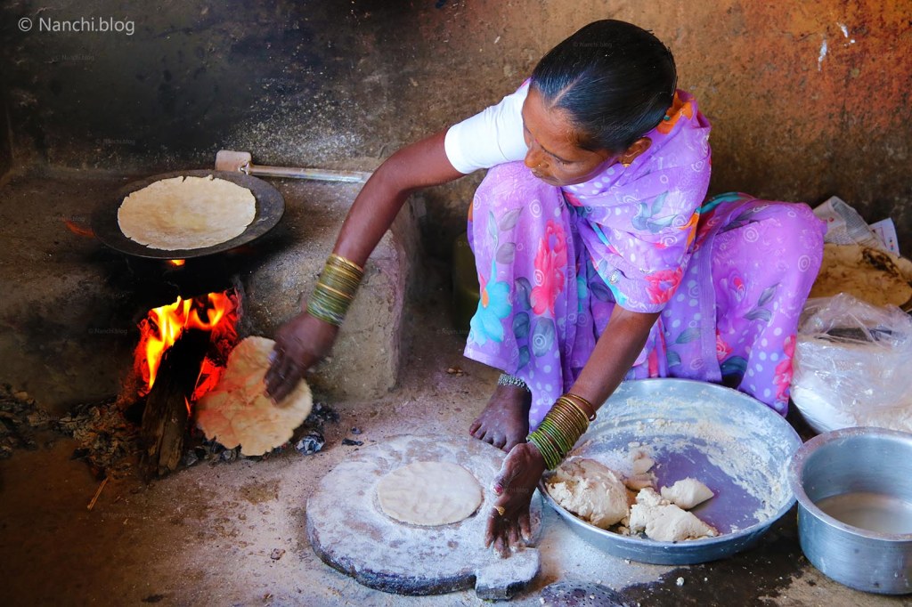 Woman cooking Bhakri on wood fire, Sinhgadh Fort, Pune